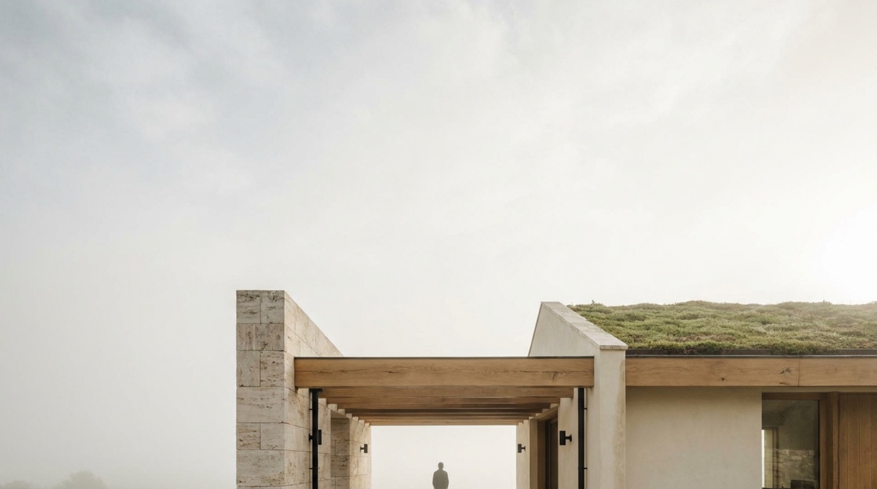 A green-roof courtyard in the morning fog, MAVI longevity residence